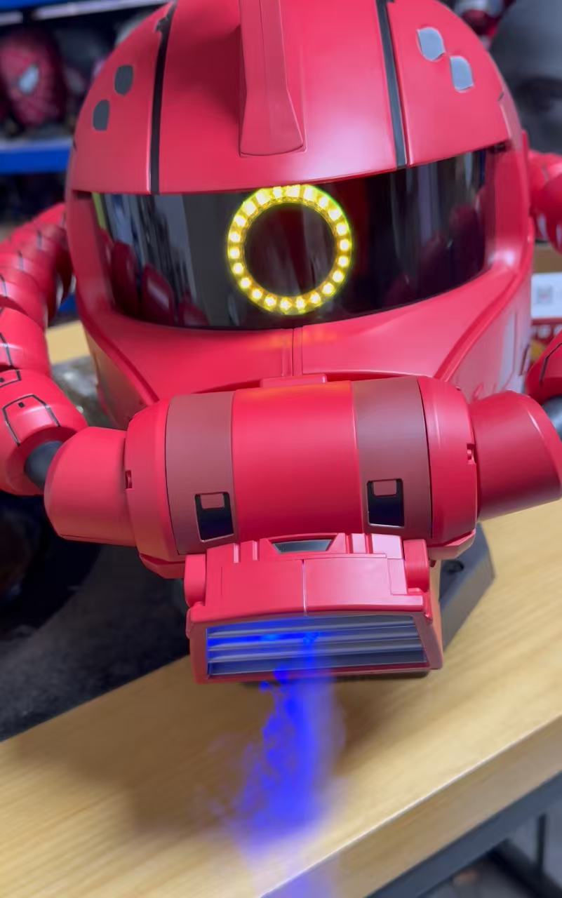 Close-up of red mecha helmet with light and smoke effect