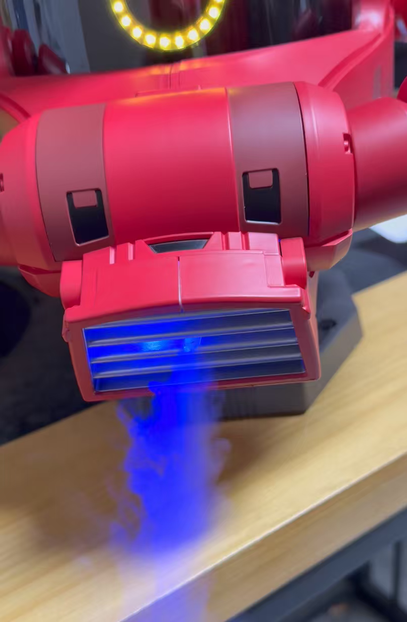 Smoke effect detail on red mono-eye mecha helmet prop